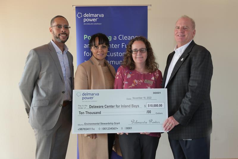 Delaware Center for the Inland Bays grant check presentation attendees shown are (l-r) Ralph Bolton, Pepco Holdings senior corporate citizenship specialist; Tasha Jamerson, Pepco Holdings senior manager of corporate relations; Meghan Noe Fellows, Delaware Center for the Inland Bays director of estuary science and restoration; and Glenn Moore, Delmarva Power region vice president. SUBMITTED PHOTO